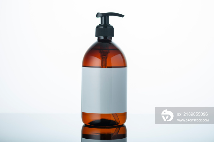 Liquid soap bottle with clean label on white and grey gradient background. Place for copy paste  tex