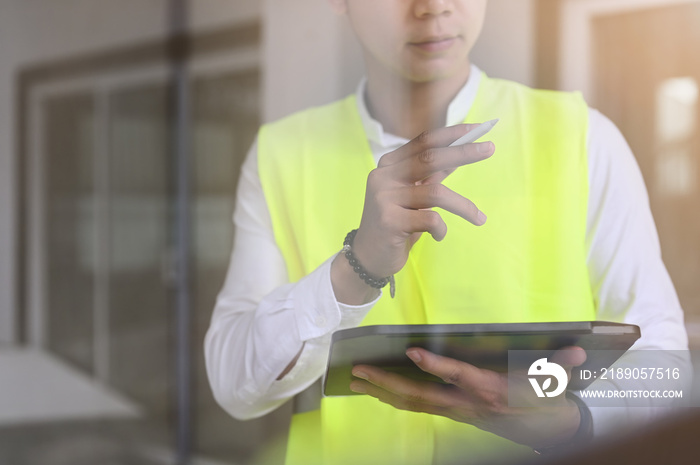 Closeup foreman officer inspector defect with tablet computer about engineer and architect work home