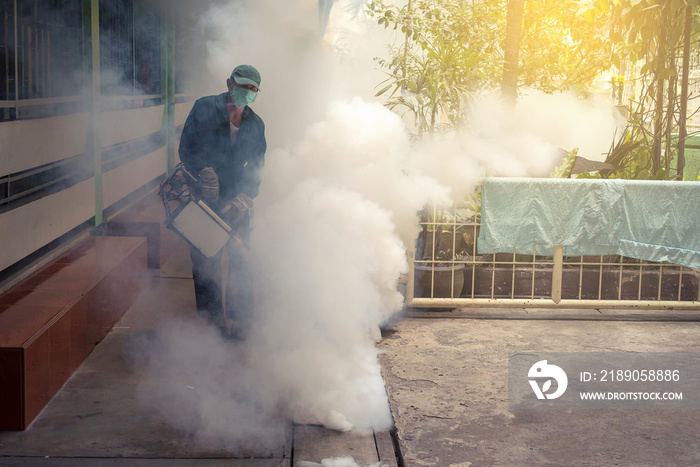 The man fogging to eliminate mosquito for prevent spread dengue fever