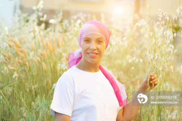 Woman with pink scarf on the head