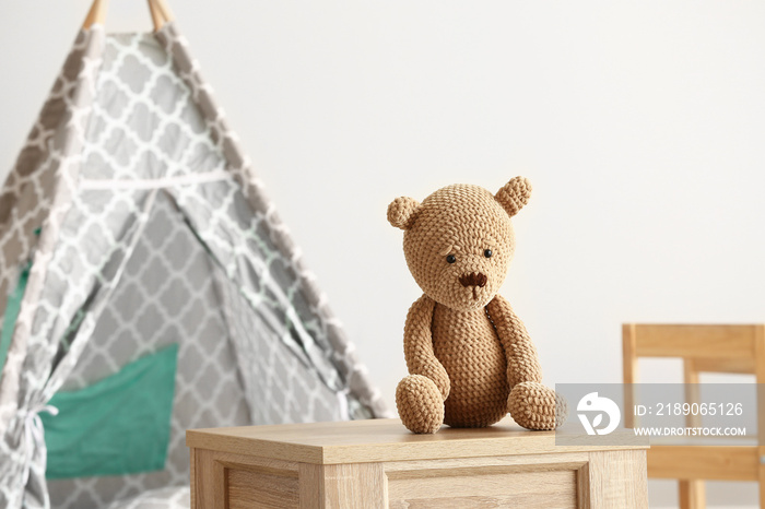 Cuddly toy on table in room