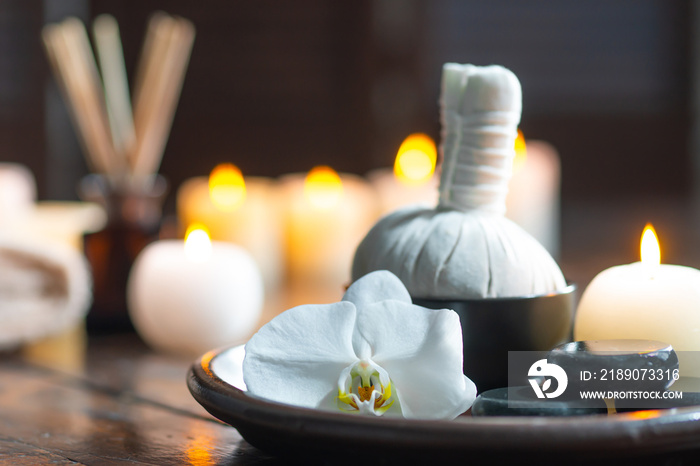 Spa background. Towel, candles, flowers, aroma sticks, massaging stones and herbal balls. Massage, o