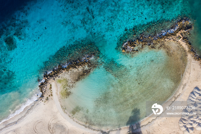 Aerial view of coast of Curaçao in the Caribbean Sea with turquoise water, cliff, beach and beautifu