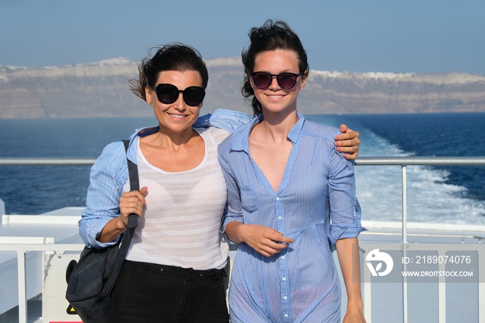 Passenger shipping, mother and teen daughter on deck of ferry