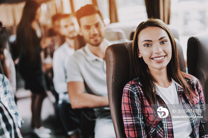 Young Smiling Woman Traveling on Tourist Bus