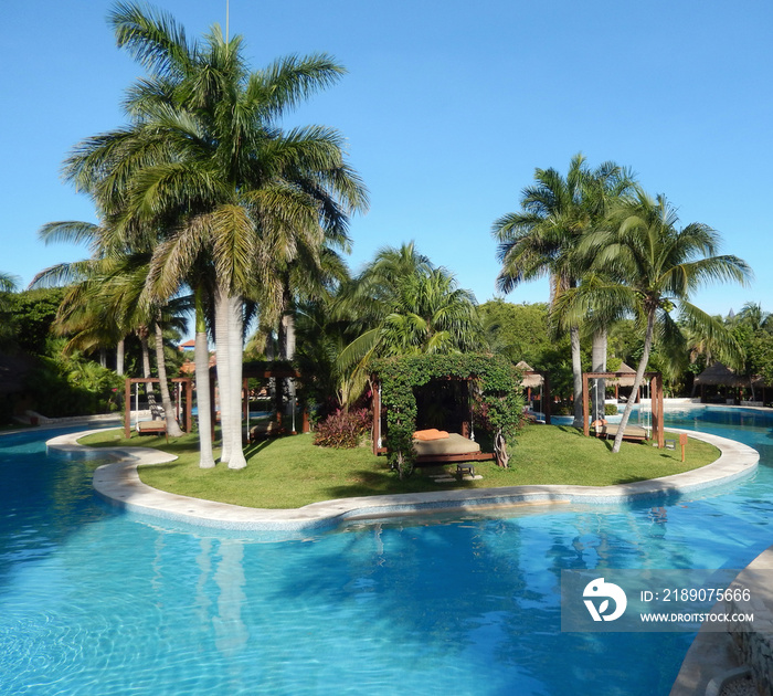Pool amenities and landscape at a luxury tropical resort in Riviera Maya, Mexico 