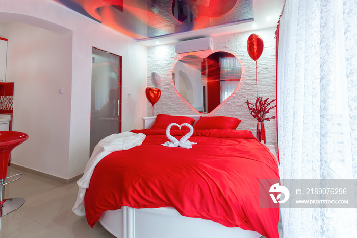 Intewrior of a romantic red hotel bedroom