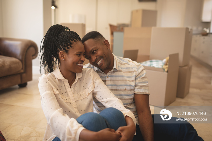 Happy African American couple head to head on floor