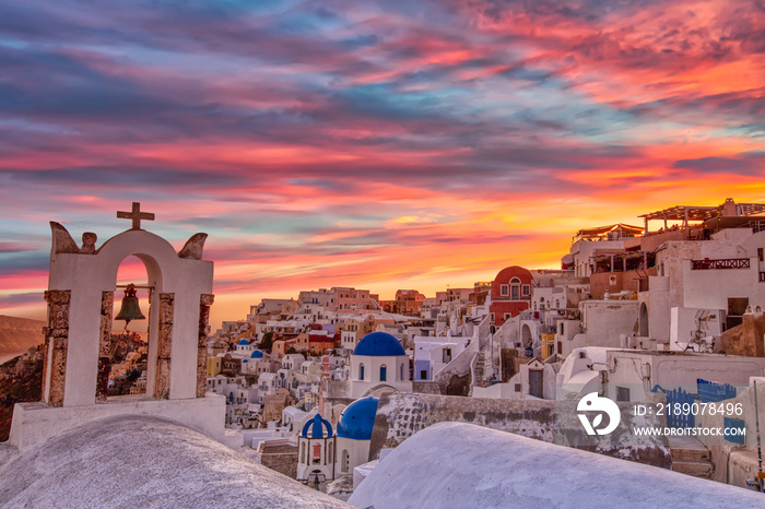 Oia village in Santorini island at sunset in Greece