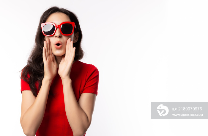 Portrait excited beautiful woman wearing retro red sunglasses. Surprised young female look telling s