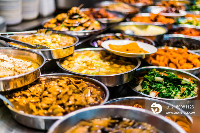 Traditional Asian dishes sold in a food court in Singapore