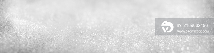 Abstract of Bright and sparkling bokeh background. silver and diamond dust bokeh blurred lighting fr