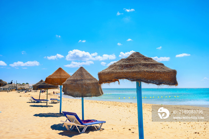 Sunshades on beach at sunny day in Nabeul. Tunisia, North Africa