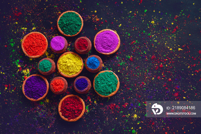 Indian Festival Holi, Colors in wooden bowl on dark background 