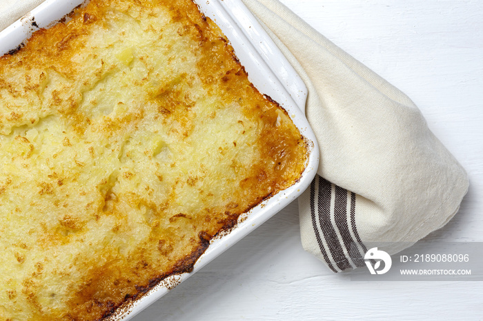 Traditional homemade shepherd pie on white background. Cottage foot