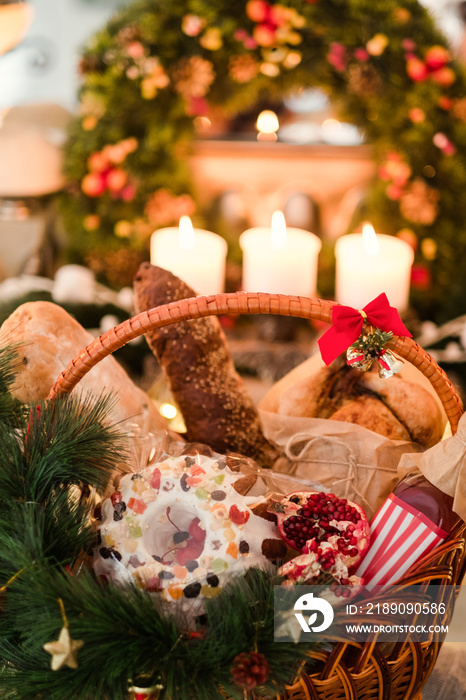 Christmas goods in a basket. Assortment of delicious festive holiday food. Great present on differen