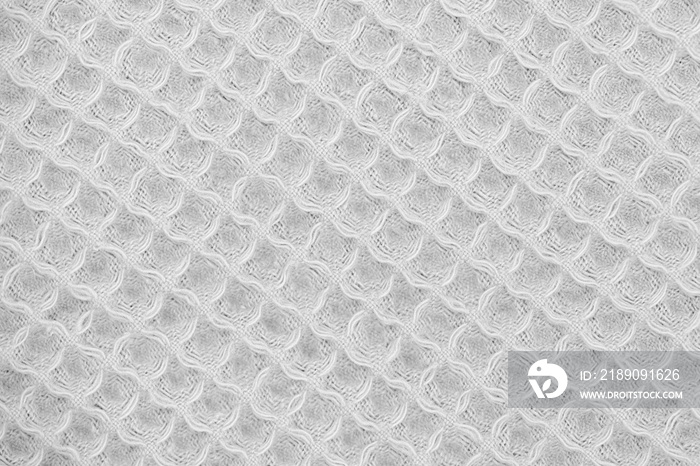 White natural texture of knitted wool textile material background. White cotton fabric woven canvas 