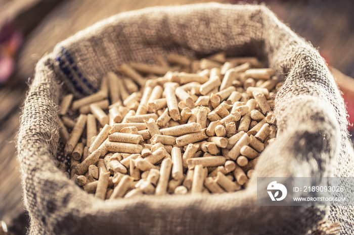 Wooden pressed pellets from biomass in old sack