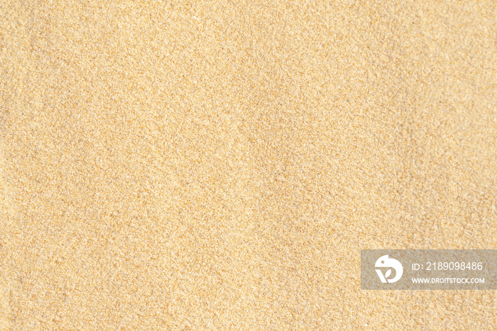 沙子质地的背景。热带海滩的棕色沙漠图案。