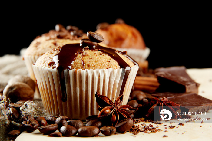 tasty muffin cakes with chocolate, spices and coffee seeds,