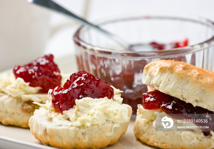 Home-baked scones with strawberry jam and clotted cream.