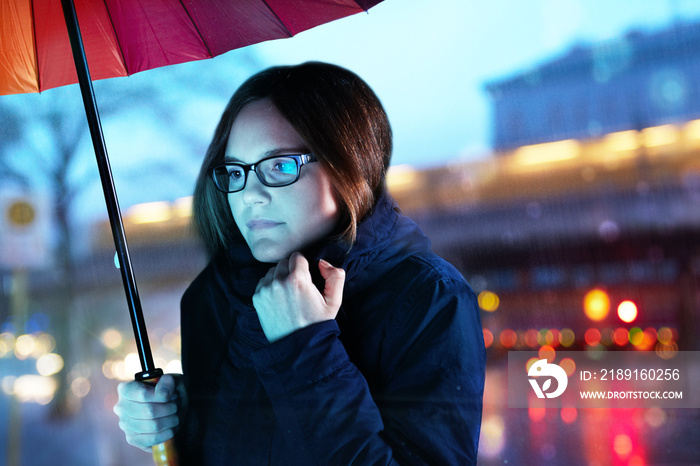 lady looking into a showcase in rainy weather