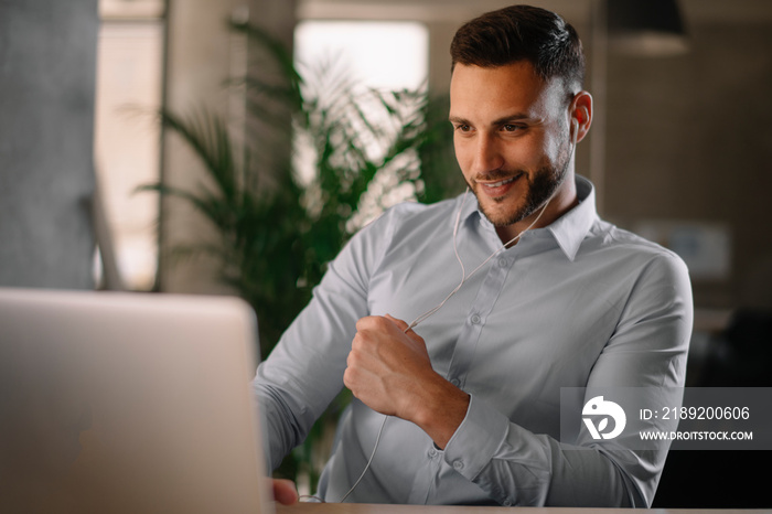 Portrait of handsome businessman. Businessman in office having video call.