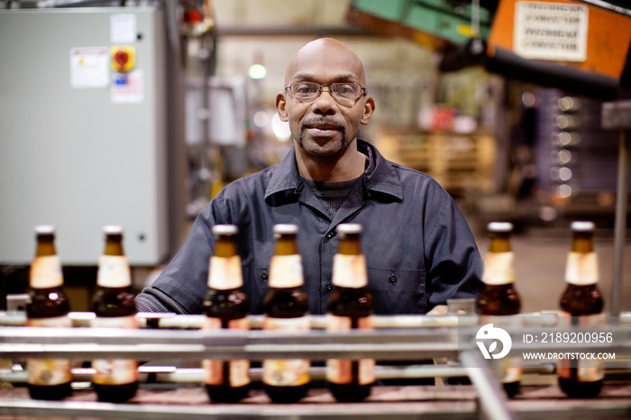 Brewery worker at assembly line