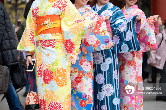 Young girl wearing Japanese kimono standing in front of Sensoji Temple in Tokyo, Japan. Kimono is a 
