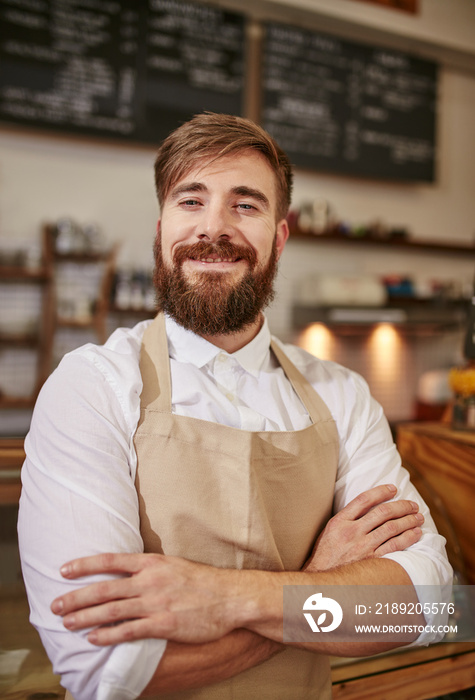 Happy young barista at work