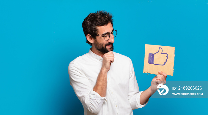 young bearded crazy man holding a social media like banner