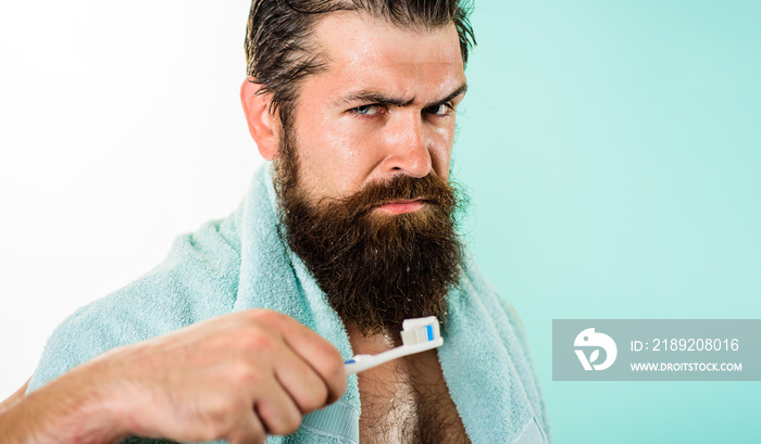 Oral care. Man brushing teeth with toothbrush. Dental higiene. Healthcare. Handsome man cleaning tee