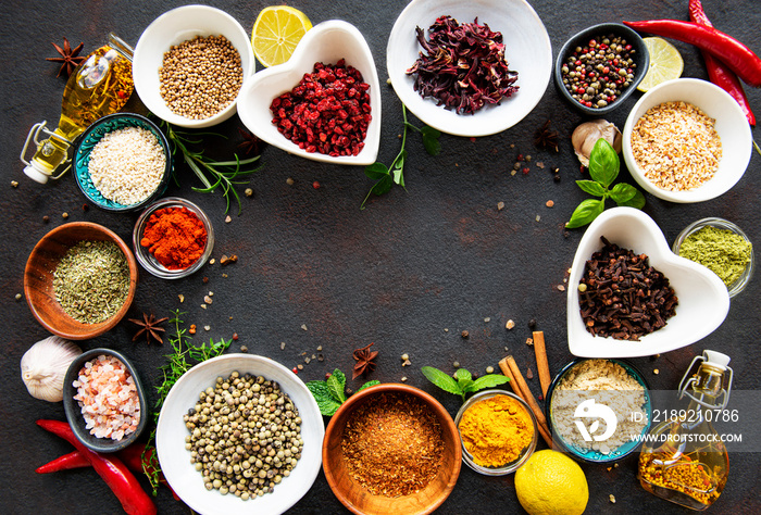 Various spices in a bowls on a black