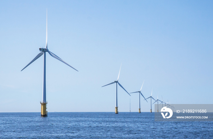 Wind turbines in an offshore wind farm in the North Sea just off the coast of the Netherlands, on a 