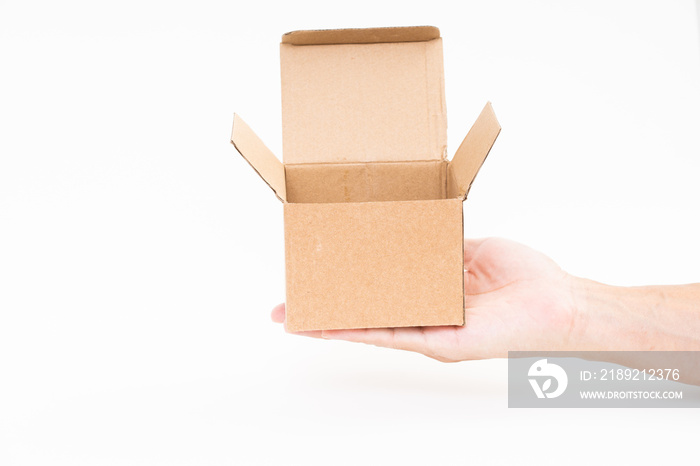 Man hand holding brown paper box on white background