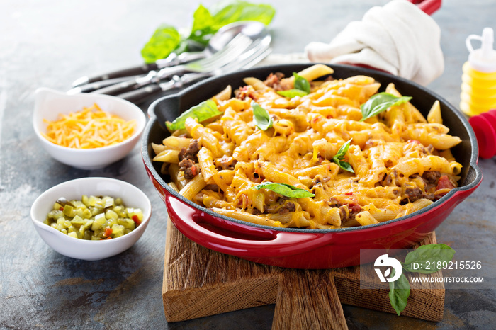 Cheesy pasta bake with ground beef and herbs