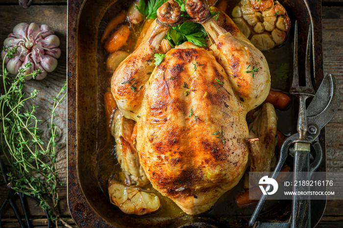 Grilled chicken with thyme and garlic. Roasted chicken with herbs.