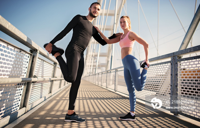 Jogging. Young couple enjoys together in the morning training outdoor. Sport, fitness, recreation co