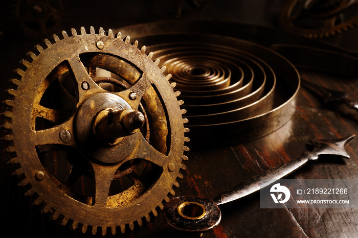 Close up of old watch gears. Dark background with retro clock as time concept.