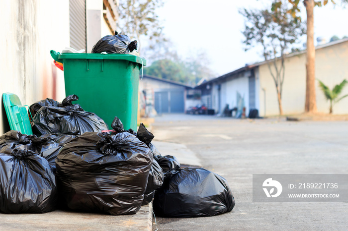 black garbage bag  with old brick wall background