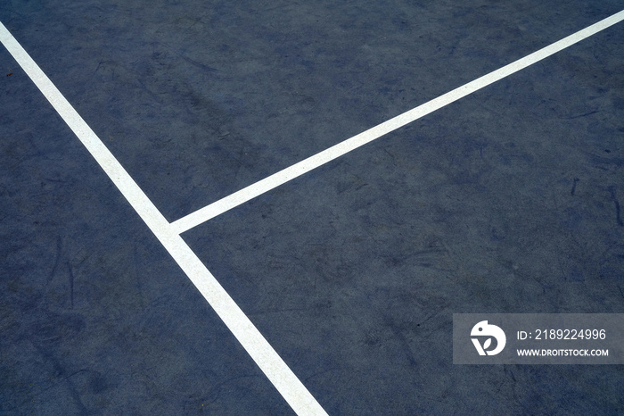 White Line on Blue Grunge Tennis Court Background with Space for Text.