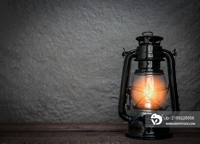 Oil lamp at night on a dark background - old Lantern vintage classic black