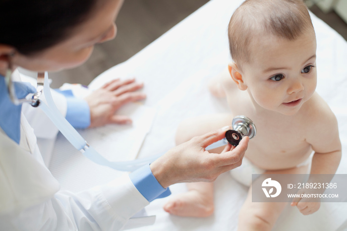 doctor examining baby