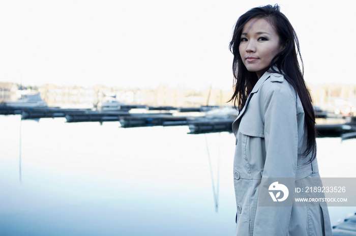 Woman overlooking still lake