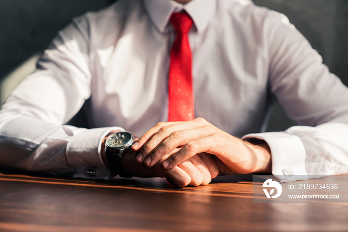 close up businessman white shirt with red necktie sit and ready to work hand together concentrate an