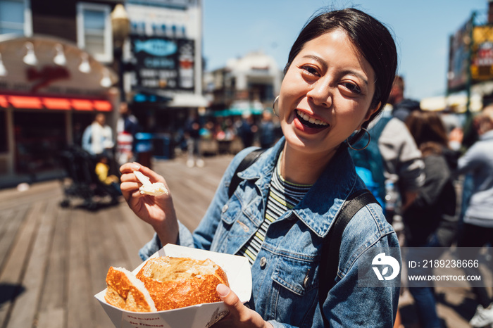 young girl having delicious local street food