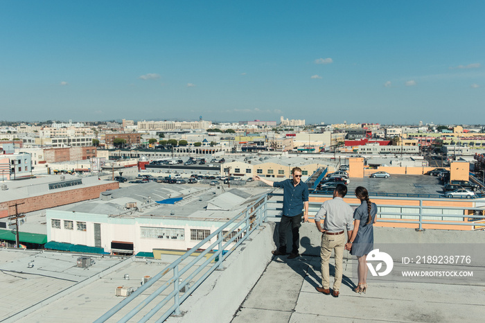 Businesspeople looking at view on roof terrace, Los Angeles, California, USA