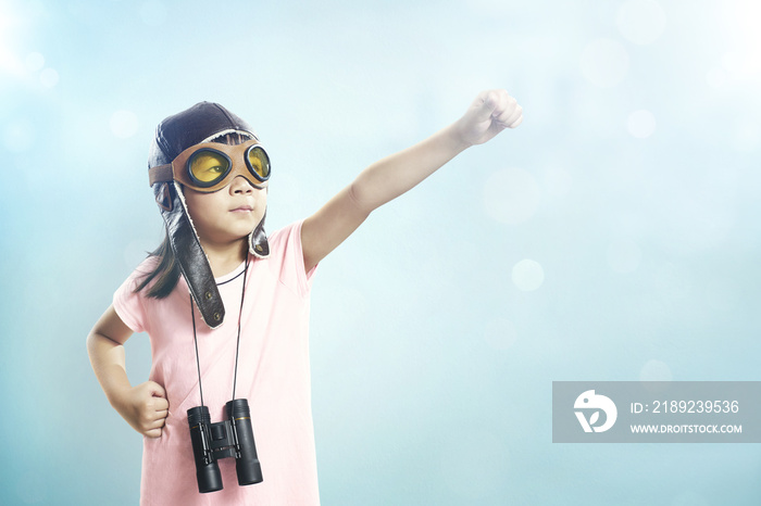 Little asian girl wear aviator glasses and telescope; dreams of becoming a pilot or explorer; Flare 