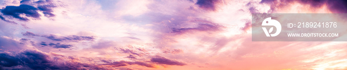 Dark blue sunset sky pano with Cumulus clouds. Sky background