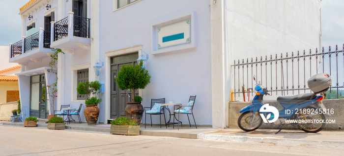 Hotel, resort waiting for visitors, customers, clients. Cafe exterior background. Table and empty ch